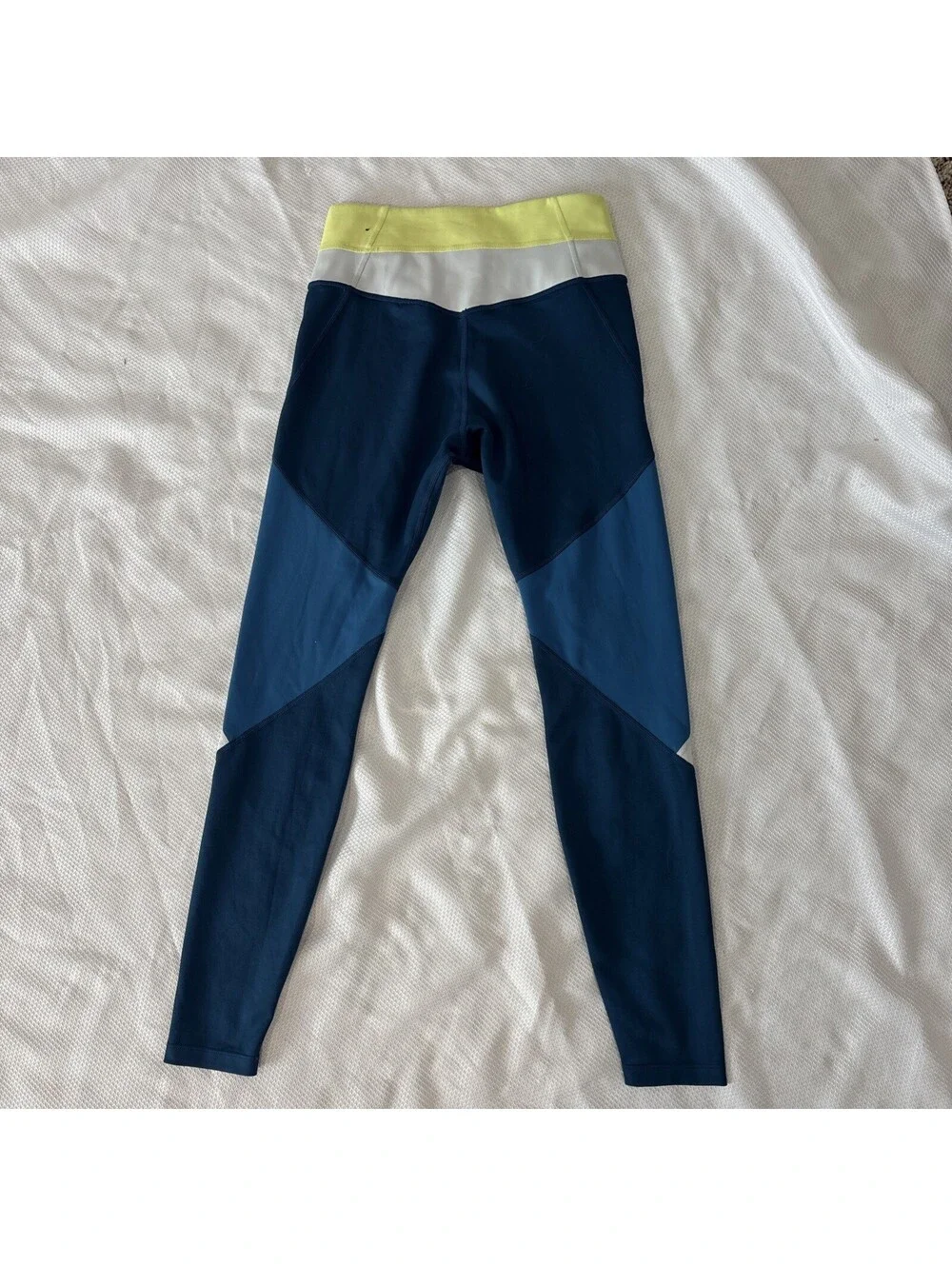 NIKE SMALL BLUE YELLOW GRAY COLOR BLOCK HIDDEN BACK POCKET DRI FIT LEGGINGS